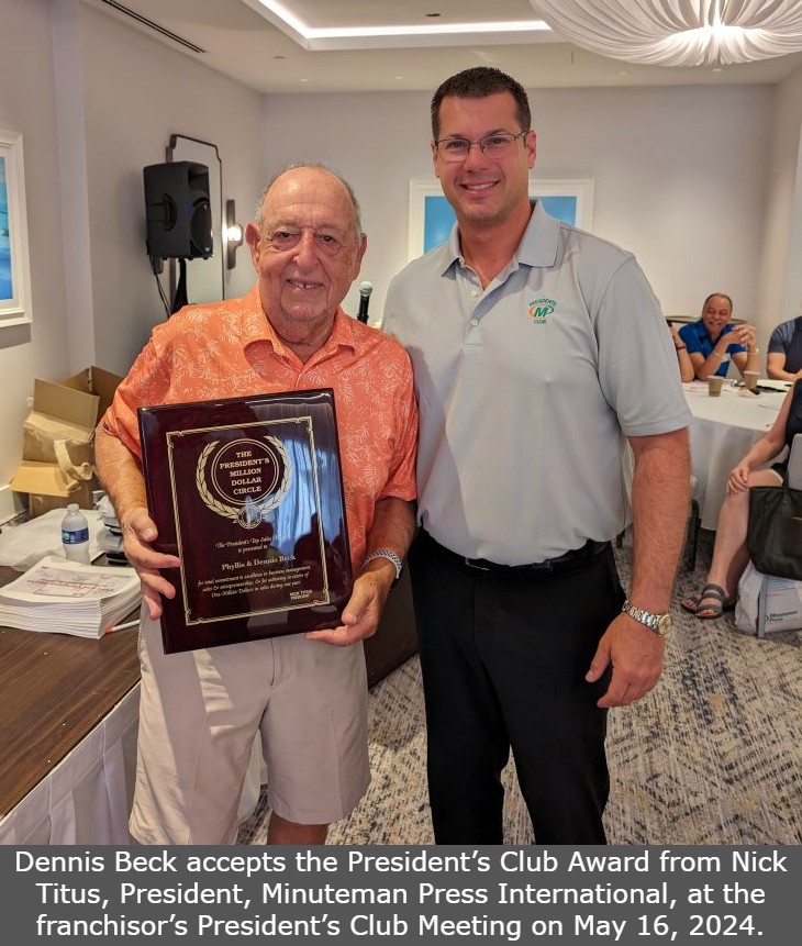 Dennis Beck accepts the President’s Club Award from Nick Titus, President, Minuteman Press International, at the franchisor’s President’s Club Meeting on May 16, 2024.